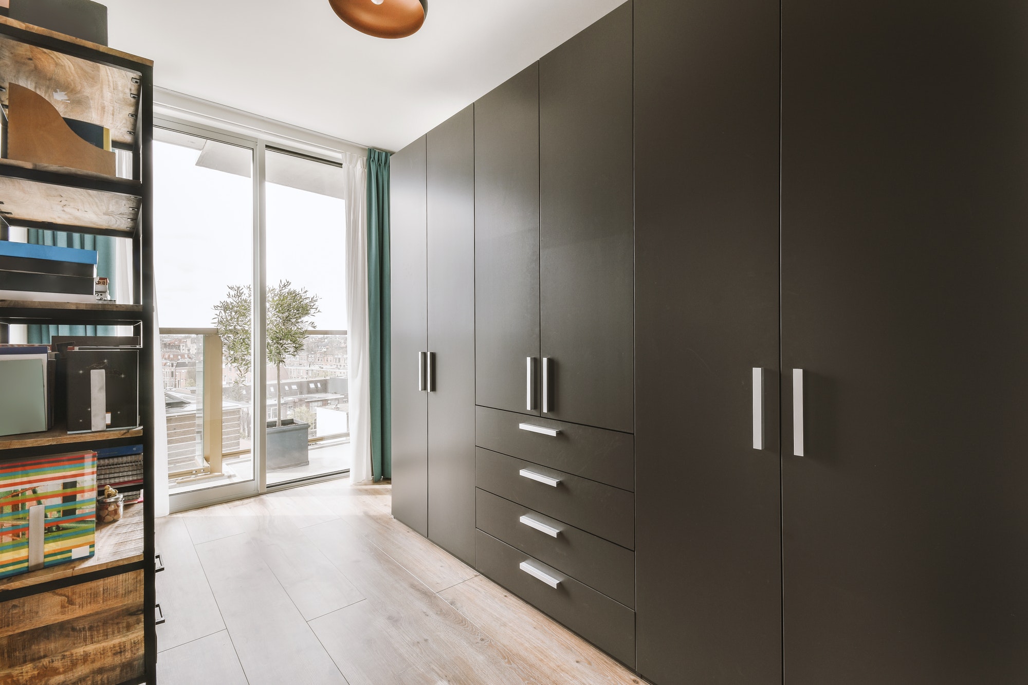 Wardrobe in light room at home